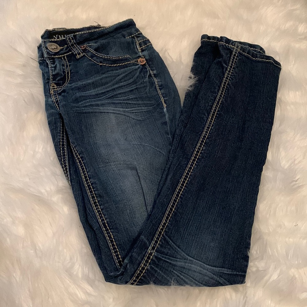 YMI Skinny Jeans. Medium/dark wash. Ripped knee. Size 0